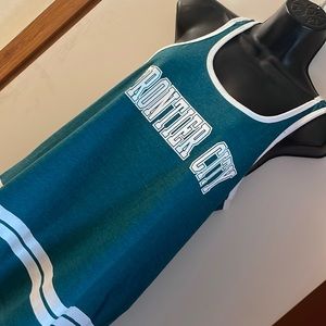 Med Racer back graphic tank. Turquoise & white varsity stripe. Frontier‎ city